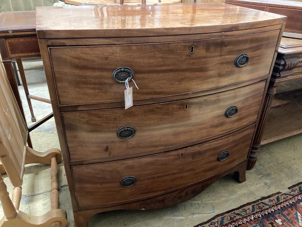 A Regency mahogany bow-fronted chest fitted three drawers, width 89cm, depth 51cm, height 86cm